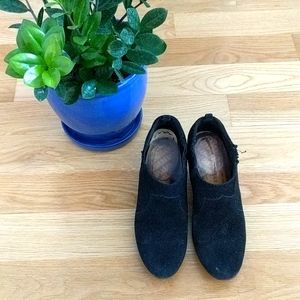 Black suede booties with wood-like heel